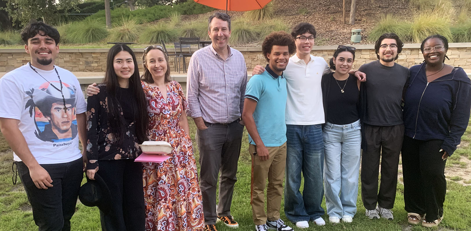 A group of Obama scholars pose with Erica Preston Roedder and Hector de la Torre.